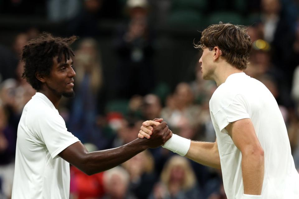 Draper shakes hands with Ymer as the match finished after 9pm (Getty Images)