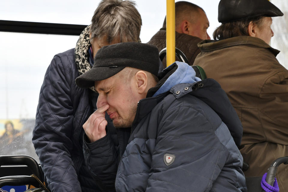A man reacts during evacuation of civilians in Kramatorsk, Ukraine, Sunday, April 10, 2022. (AP Photo/Andriy Andriyenko)