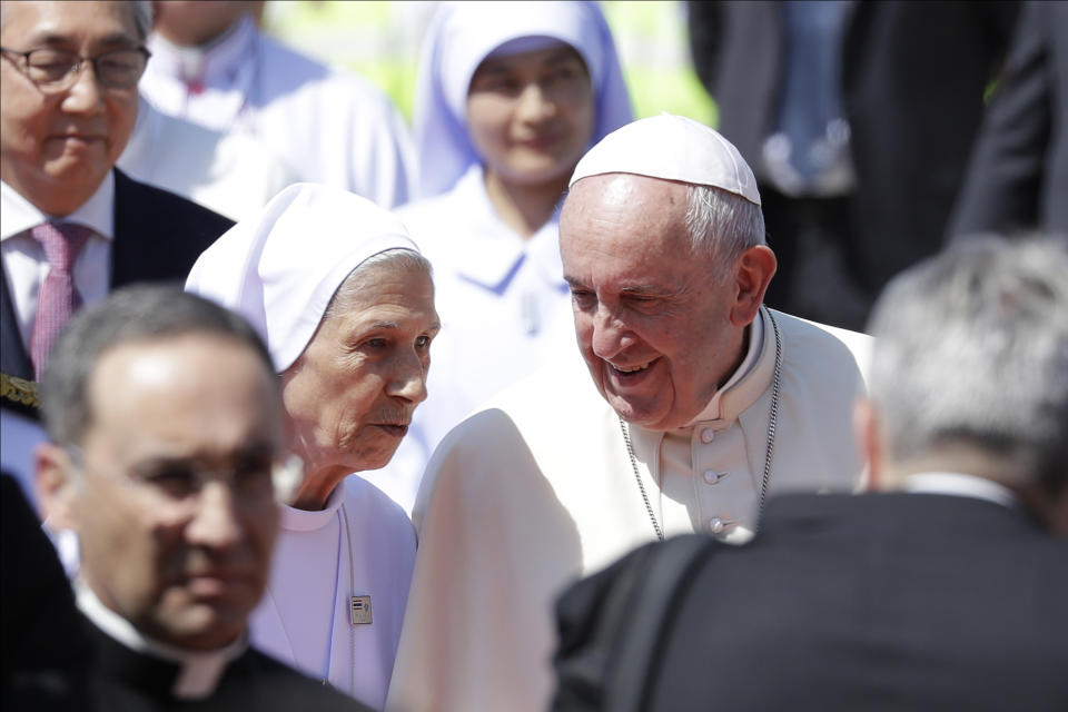 Pope Francis talks to his cousin Ana Rosa Sivori as he arrives at Military Air Terminal of Don Muang Airport, Wednesday, Nov. 20, 2019, in Bangkok, Thailand. (AP Photo/Gregorio Borgia)