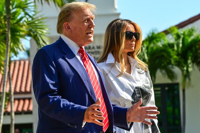 <p>GIORGIO VIERA/AFP via Getty</p> Donald and Melania Trump arrive at a Florida polling station to vote in the Republican presidential primary election on March 19, 2024