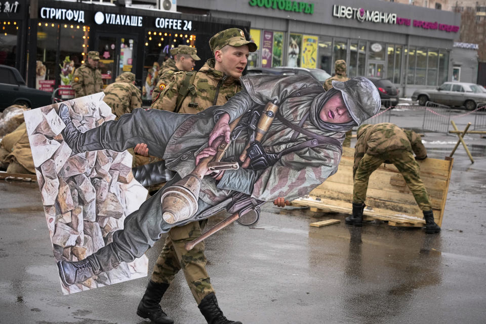 A military cadet carries a figure of a Nazi German soldier during a military festival dedicated to the upcoming Victory Day in World War II in St. Petersburg, Russia, Saturday, April 20, 2024. (AP Photo/Dmitri Lovetsky)