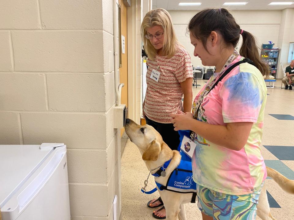 Jazmin Tinsley, 23, of Rehoboth Beach, and her Canine Companions service dog, Bonus, run through commands she can use to help with her disabilities. She received the dog for free from the organization and has seen improvements in her independence and social skills.
