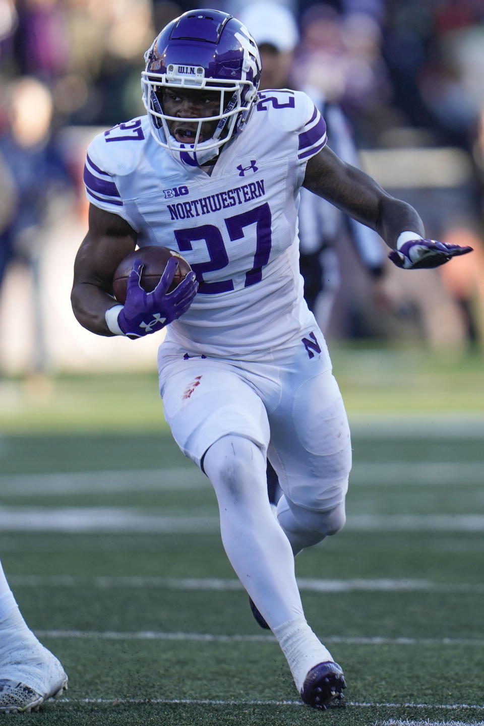 CORRECTS TO RUNNING BACK ANTHONY TYUS III NOT DEFENSIVE BACK JACK OYOLA - Northwestern running back Anthony Tyus III carries the ball during the first half of an NCAA college football game against Illinois, Saturday, Nov. 25, 2023, in Champaign, Ill. (AP Photo/Erin Hooley)