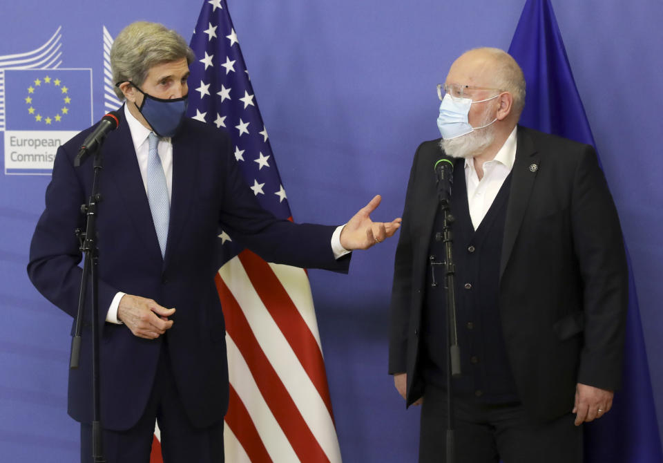 European Commissioner for European Green Deal Frans Timmermans, right, and U.S Special Presidential Envoy for Climate John Kerry address a media conference at EU headquarters in Brussels, Tuesday, March 9, 2021. US special envoy for climate John Kerry traveled to Brussels Tuesday to discuss trans-Atlantic cooperation with European officials in the wake of President Joe Biden's decision to rejoin the global effort to curb climate change. (Olivier Hoslet, Pool via AP)