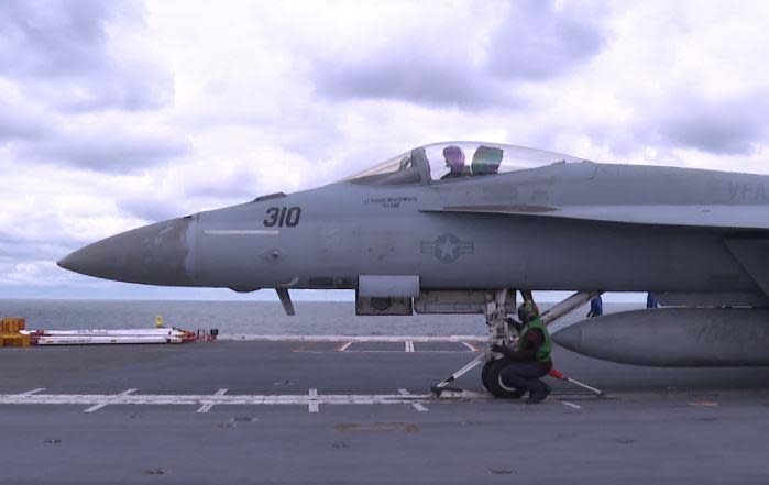 An F/A-18E Super Hornet locks into the electromagnetic aircraft launch system.  / Credit: Eleanor Watson