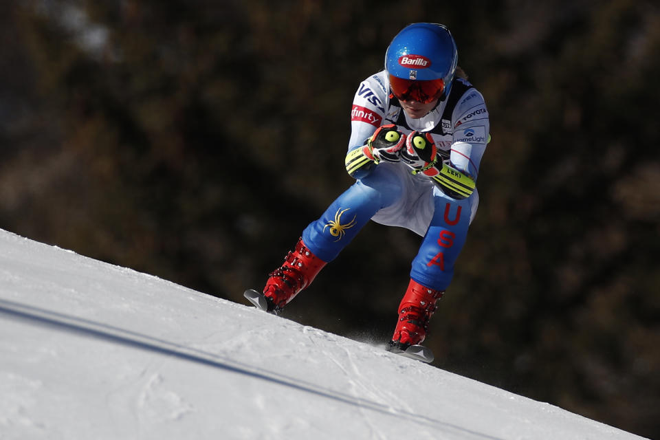 United States' Mikaela Shiffrin speeds down the course of an alpine ski, women's World Cup super-G race in Cortina d'Ampezzo, Italy, Sunday, Jan. 23, 2022. (AP Photo/Gabriele Facciotti)