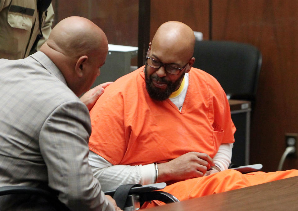 Marion ‘Suge’ Knight (R) appears in court with his Lawyer Matthew P Fletcher for a preliminary hearing in a robbery charge case at Criminal Courts Building on April 8, 2015 in Los Angeles, California. Knight is charged with robbery and criminal threats after allegedly stealing a photographer’s camera during an incident September 5, 2014 in Beverly Hills. - Credit: David Buchan/Getty Images