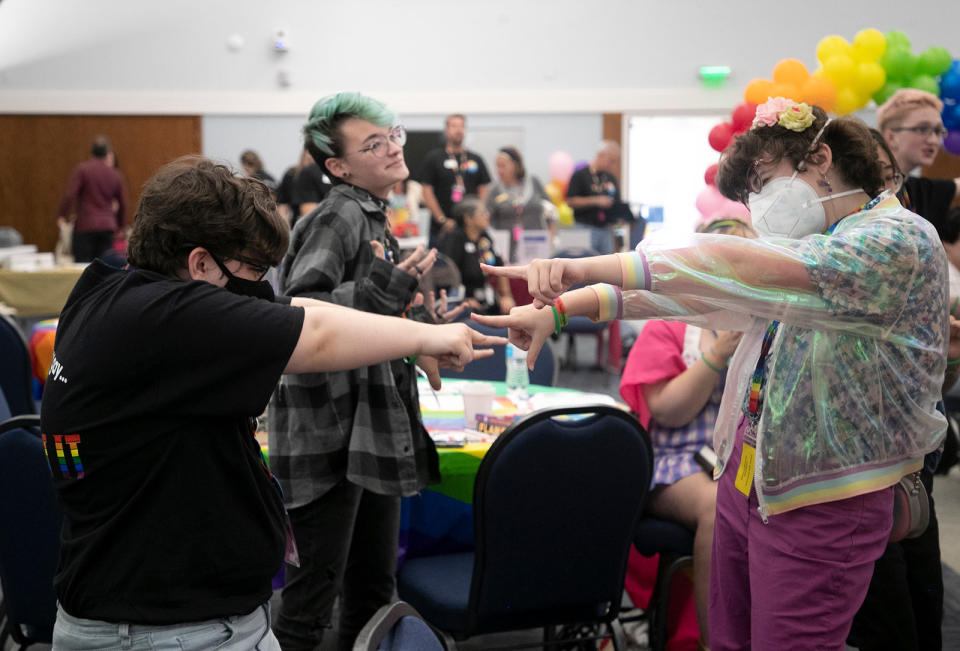 Ash (center) dances with Ollie and other attendees of the 2023 Youth Pride Conference on March 25, 2023, in Naples, Florida.