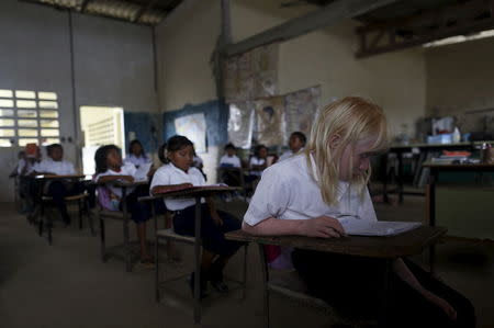 Yaisseth Morales, 11, who is part of the albino or "Children of the Moon" group in the Guna Yala indigenous community, is seen in her classroom at the local school on Ustupu Island in the Guna Yala region, Panama April 27, 2015. REUTERS/Carlos Jasso