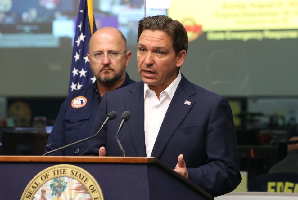 Florida Gov. Ron DeSantis, right, and Kevin Guthrie, executive director of the Florida Division of Emergency Management, provide an update about Tropical Storm Idalia at the State Emergency Operations Center in Tallahassee on Sunday, Aug. 27, 2023.