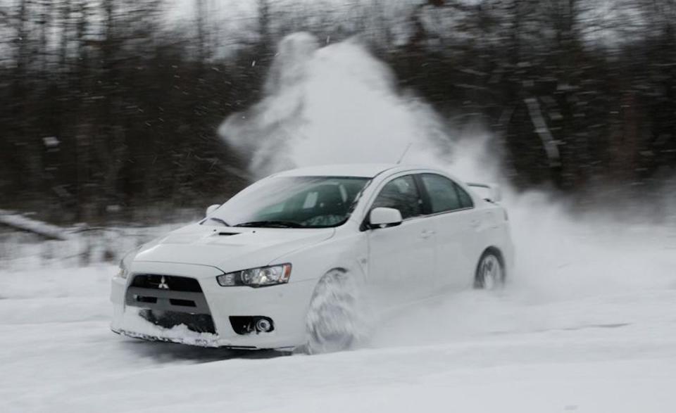 By the time <em>C/D</em> was wrapping up its <a href="http://www.caranddriver.com/reviews/2008-mitsubishi-lancer-evolution-mr-long-term-road-test-review" rel="nofollow noopener" target="_blank" data-ylk="slk:long-term test of a 2008 Evo MR;elm:context_link;itc:0;sec:content-canvas" class="link ">long-term test of a 2008 Evo MR</a>, it was apparent that the Evo was getting expensive and had lost some of its mesmerizing raw edge. “When our long-term 2008 Mitsubishi Lancer Evolution MR arrived in July 2008, we were hit by a wave of sticker shock,” reported Michael Austin. “At an as-delivered price of $41,515, the Evo exceeded the starting price of a <a href="http://www.caranddriver.com/comparisons/2009-bmw-335i-page-2" rel="nofollow noopener" target="_blank" data-ylk="slk:BMW 335i;elm:context_link;itc:0;sec:content-canvas" class="link ">BMW 335i</a>.<br><br>“The following theme emerged from the logbook: Everything in the Evo comes at a price,” Austin continued. “Especially at the gas pump. With its SUV-like EPA rating of 17 mpg in the city and 22 on the highway—and a 14.5-gallon fuel tank—we didn’t anticipate bladder-busting range, but the Evo continually surprised us with its need for frequent fill-ups.”<br><br>“There are few sedans that can match the performance of the Lancer Evolution,” he concluded. “As is often the case, however, numbers aren’t everything. Without a regular opportunity to take advantage of all of the Evo’s capability, the compromises that come with its performance left us wishing for a lower sticker price, more refinement, or both.”