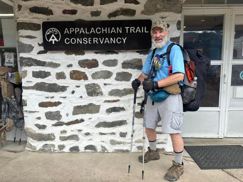 Rob Weisberg poses for a photo outside a building for the Appalachian Trail Conservancy, a nonprofit dedicated to preserving the historic trail.