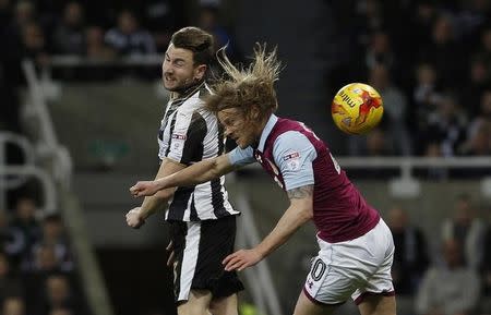 Britain Football Soccer - Newcastle United v Aston Villa - Sky Bet Championship - St James' Park - 20/2/17 Newcastle United's Ciaran Clark (L) in action with Aston Villa's Birkir Bjarnason Mandatory Credit: Action Images / Craig Brough Livepic