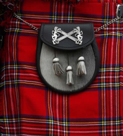 A kilt is seen hanging outside a shop in Holyrood Edinburgh, Scotland March 10, 2017. Picture taken March 10, 2017 REUTERS/Russell Cheyne