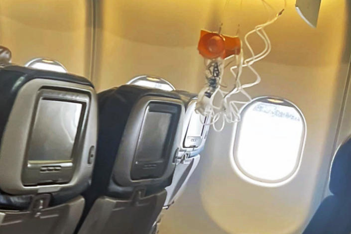 Oxygen masks on a Hawaiian Airlines plane after severe turbulence injured passengers on Dec. 18. (Jazmin Bitanga / AP)