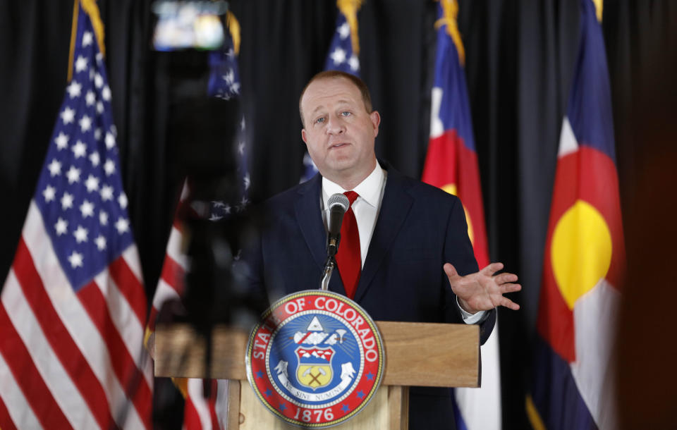 Colorado Governor Jared Polis makes a point duiring a news conference to update the state's efforts to check the spread of the new coronavirus Monday, May 11, 2020, in Denver. (AP Photo/David Zalubowski)