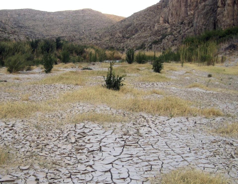 Dry, cracked mud along the banks of the Rio Grande at Big Bend National Park in Texas, March 25, 2011. In the spring and early summer of 2022, up to 75 miles of the river went dry in the park. <a href="https://newsroom.ap.org/detail/LaNina/28075c648a3c4faa9284a3312c7c0f36/photo" rel="nofollow noopener" target="_blank" data-ylk="slk:AP Photo/Mike Graczyk;elm:context_link;itc:0;sec:content-canvas" class="link ">AP Photo/Mike Graczyk</a>