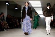 Models present creations during the Yuhan Wang catwalk show at London Fashion Week in London