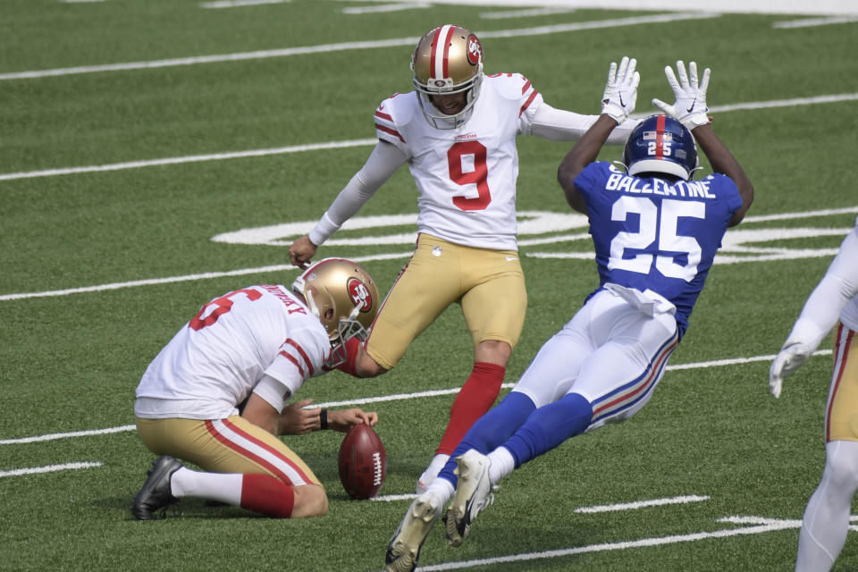 San Francisco 49ers' Robbie Gould, center, kicks a field goal while New York Giants' Corey Ballentine tries to defend during the first half of an NFL football game, Sunday, Sept. 27, 2020, in East Rutherford, N.J. (AP Photo/Bill Kostroun)