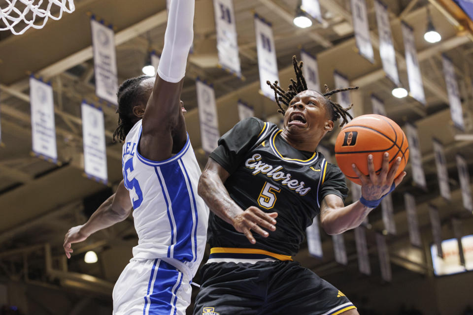 La Salle's Khalil Brantley (5) shoots as Duke's Mark Mitchell (25) defends during the first half of an NCAA college basketball game in Durham, N.C., Tuesday, Nov. 21, 2023. (AP Photo/Ben McKeown)