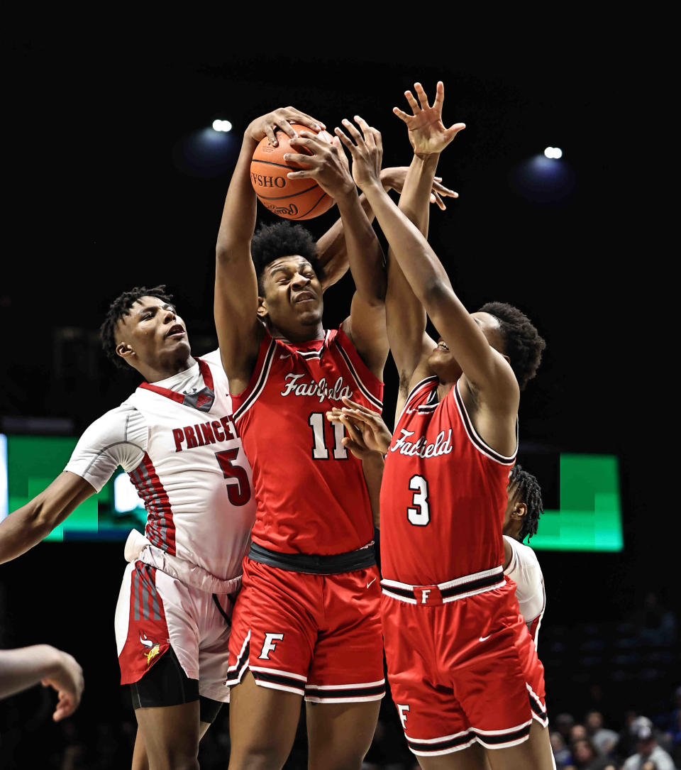 Fairfield's Aamir Rogers (11) and Kameron Sanders (3) battle Princeton's Dorian Williams (5) for a rebound during their regional semifinal Wednesday, March 8, 2023.