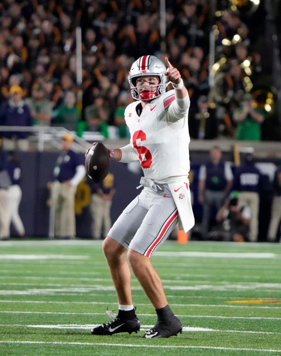 Sep 23, 2023; South Bend, Indiana, USA; Ohio State Buckeyes quarterback Kyle McCord (6) looks for an open receiver against Notre Dame Fighting Irish during the fourth quarter of their game at Notre Dame Stadium.