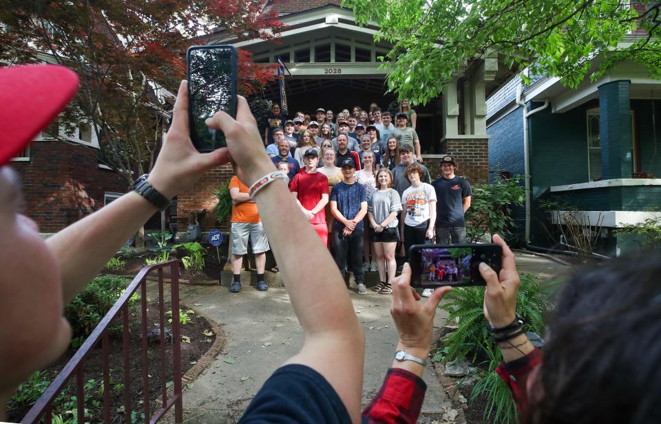 Parents take photos of the their sons an daughters on the steps of Charlie and Wendy Sommers home on Eastern Parkway on Saturday, May 13, 2023.