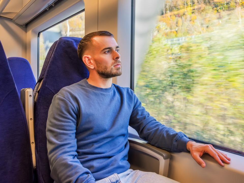 A young man on a train.