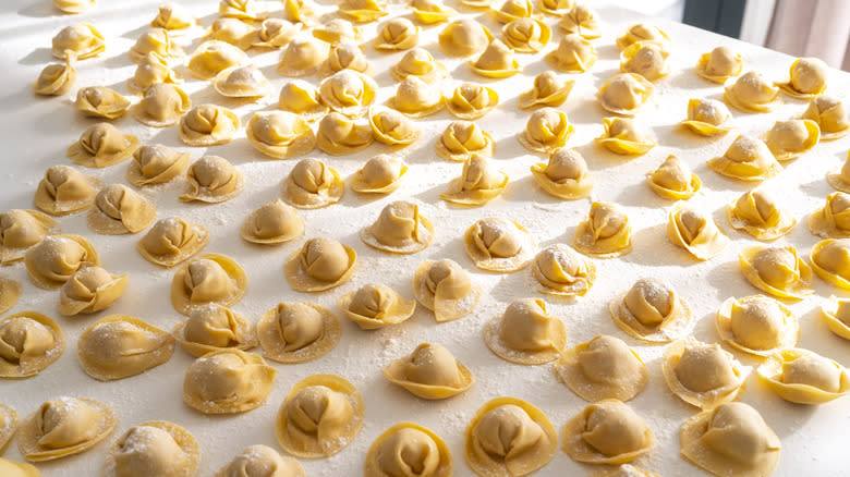 Dried handmade cappelletti on table