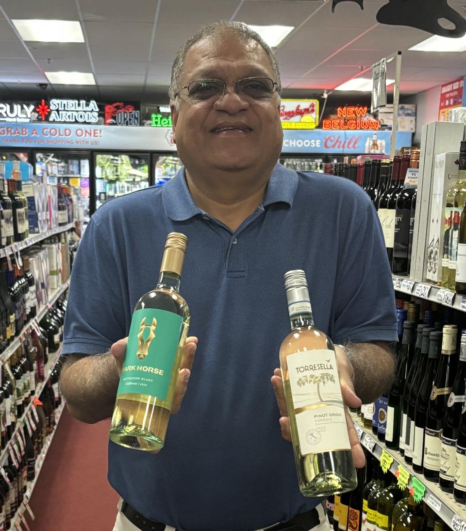 What wine goes best with cicada? Upen Patel, owner of Discount Liquor in East Peoria suggests a sauvignon blanc (left) or a pinot grigio.