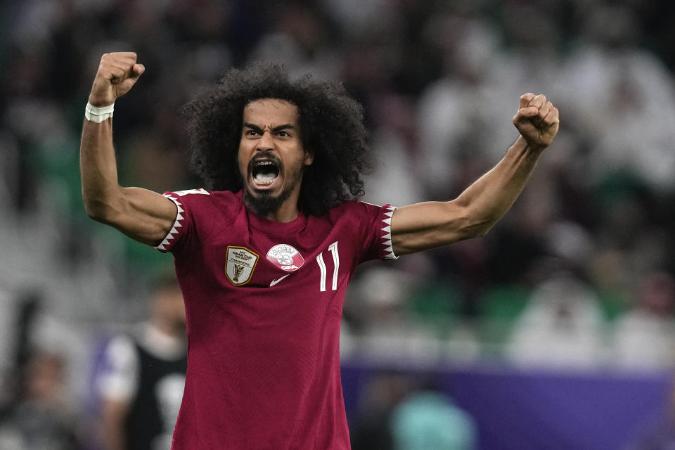 Qatar's Akram Afif reacts minutes before the end of the match as his team leads 3-2 during the Asian Cup semifinal soccer match between Qatar and Iran at Al Thumama Stadium in Doha, Qatar, Wednesday, Feb. 7, 2024. (AP Photo/Thanassis Stavrakis)