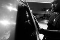 <p>Billy Garcia and daughter Esmeralda enjoy a tender moment at a gas station, Bronx, N.Y., 2012. (Photograph © Zun Lee) </p>