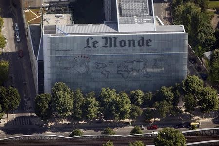 An aerial view shows the facade of the French daily evening newspaper Le Monde offices in Paris July 14, 2013. REUTERS/Charles Platiau