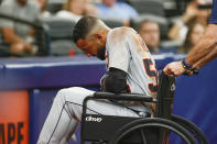 Detroit Tigers' Derek Hill is wheeled off the field during the fifth inning of a baseball game against the Tampa Bay Rays Saturday, Sept. 18, 2021, in St. Petersburg, Fla. (AP Photo/Scott Audette)