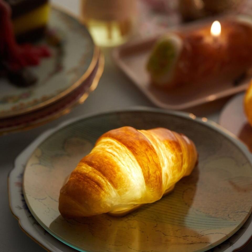 If they prefer to start off their day with something simple like a croissant and coffee combo, you can't go wrong with getting them this croissant lamp. It's made from a real croissant that's been preserved in resin. <a href="https://fave.co/36QRKMk" target="_blank" rel="noopener noreferrer">Find it for $88 at Catbird</a>.