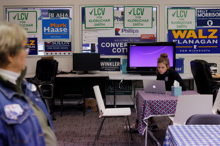 Campaign volunteers gather at a Democratic-Farmer-Labor Party office in Plymouth, Minnesota, U.S., October 27, 2018. Picture taken October 27, 2018. REUTERS/Brian Snyder