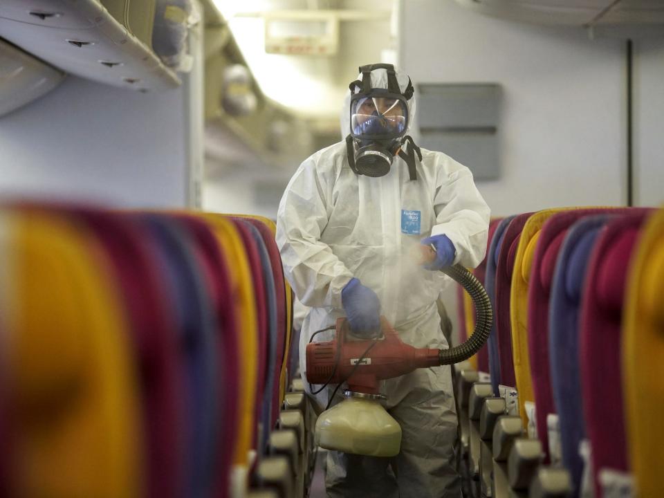 wuhan coronavirus airplane disinfect suit thailand