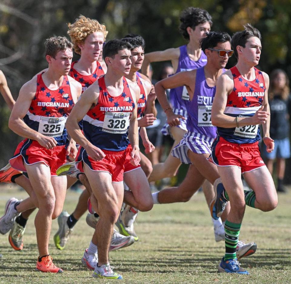 The Buchanan boys cross country team run together off the start of the Central Section boys Division 1 championship cross country race at Woodward Park on Thursday, Nov. 16, 2023. The Bears finished second overall.