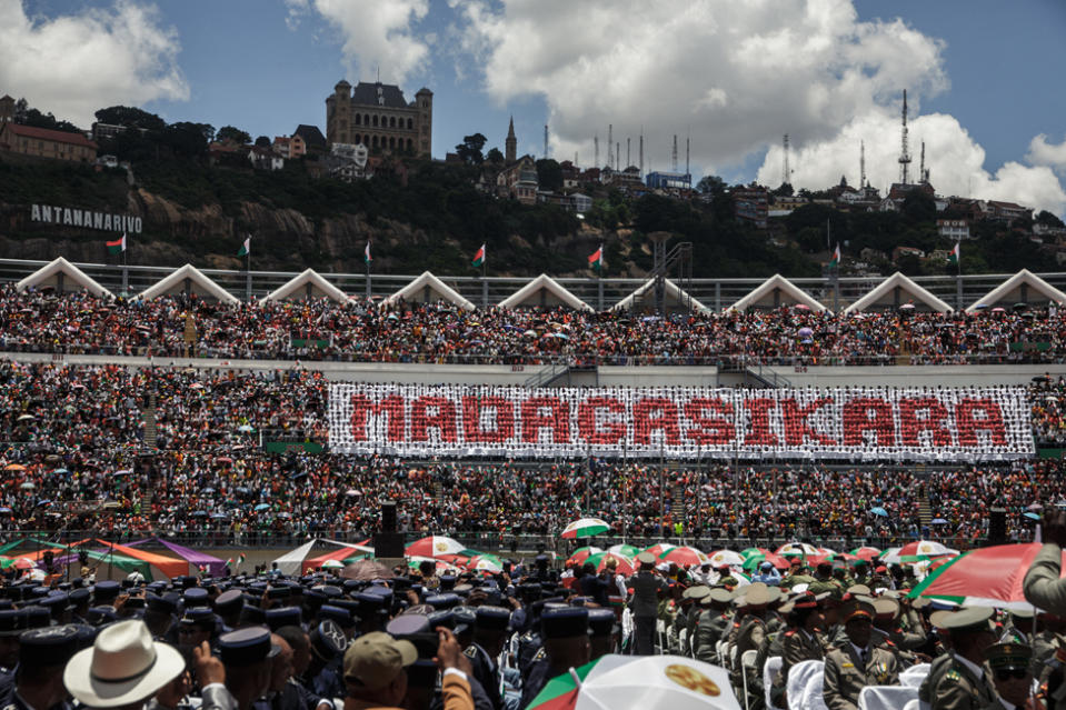 Supporters attend the presidential inauguration ceremony of the re-elected President of the Republic of Madagascar Andry Rajoelina in Antananarivo on December 16, 2023. President Andry Rajoelina took the oath in a packed stadium on Saturday to start a new term as Madagascar's leader, rebuffing an opposition boycott and international concerns over the island's future