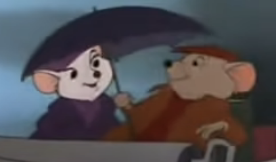 close up of two mice under an umbrella