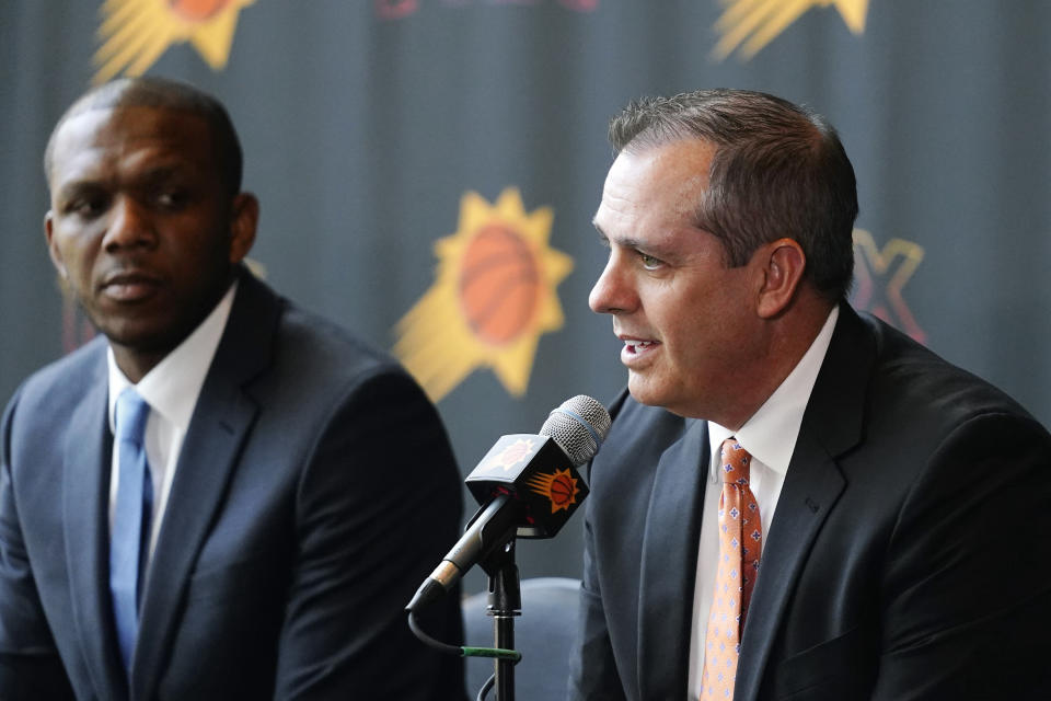 James Jones, left, president of basketball operations and general manager for the Phoenix Suns, as Suns new head coach Frank Vogel, right, speaks during a news conference Tuesday, June 6, 2023, in Phoenix. (AP Photo/Ross D. Franklin)