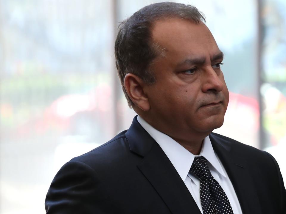 Former Theranos COO Ramesh Balwani (L) arrives at the Robert F. Peckham U.S. Federal Court on April 22, 2019 in San Jose, California. Former Theranos CEO Elizabeth Holmes and former COO Ramesh Balwani appeared in federal court for a status hearing. Both are facing charges of conspiracy and wire fraud for allegedly engaging in a multimillion-dollar scheme to defraud investors with the Theranos blood testing lab services.