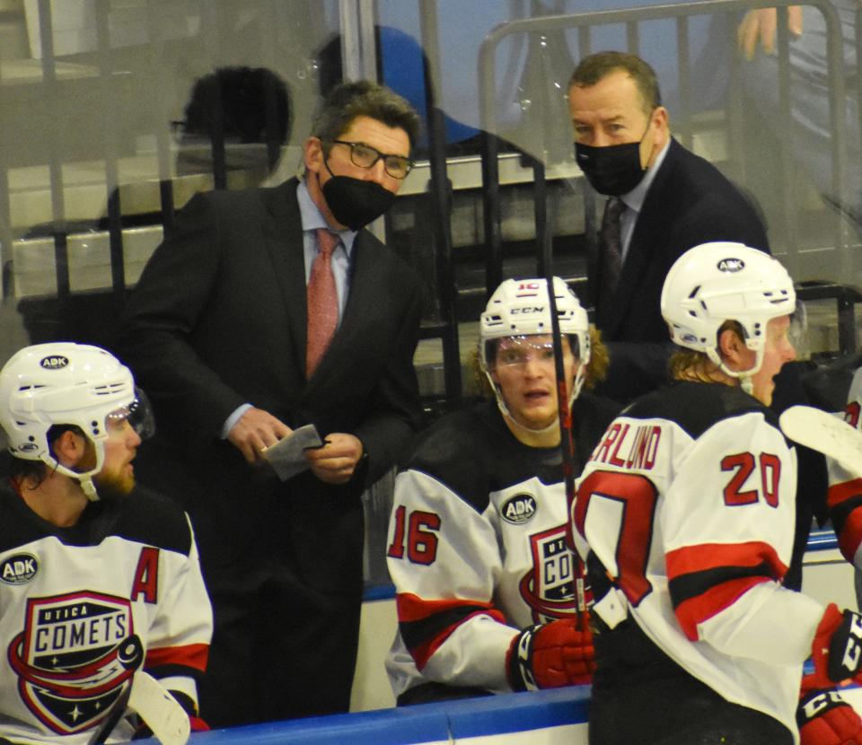 Coaches Sergei Brylin, left, and Kevin Dineen talk things over during a recent Utica Comets game. The team is 4-3-3-0 in the last 10 games.