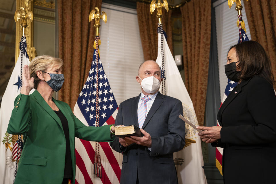 Secretary of Energy Jennifer Granholm participates in a ceremonial swearing-in with Vice President Kamala Harris on February 25, 2021 in Washington, D.C. Holding the Bible at center is Granholm's husband, Dan Mulhern.  / Credit: Drew Angerer / Getty Images