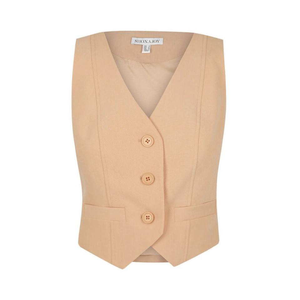 <p><a href="https://shonajoy.com/products/irena-tailored-fitted-vest-peanut-butter?gclid=CjwKCAjwyqWkBhBMEiwAp2yUFlwmyxxLGTR14z6iQCfV5FYosm6_0xG2xuEYr6qrK-h1ngOFyTychhoCOTEQAvD_BwE" rel="nofollow noopener" target="_blank" data-ylk="slk:Shop Now;elm:context_link;itc:0;sec:content-canvas" class="link ">Shop Now</a></p><p>Irena Tailored Fitted Vest </p><p>shonajoy.com</p><p>$155.00</p>