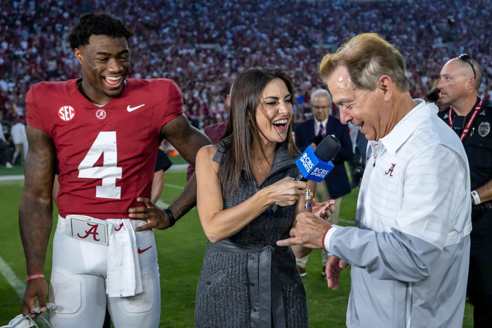 CBS reporter Jenny Dell gifts a cigar to Alabama head coach Nick Saban after the Crimson Tide's 34-20 victory over Tennessee on Oct. 21, 2023, in Tuscaloosa, Ala. Cigars are a tradition for the victor of the Alabama-Tennessee series. (AP Photo/Vasha Hunt)