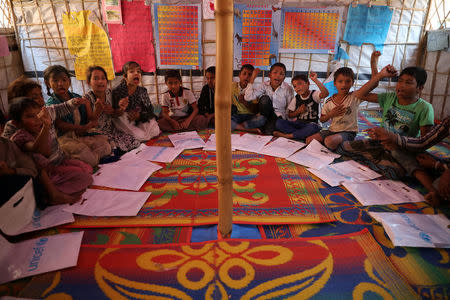 Rohingya children attend classes in a learning centre run by UNICEF at Balukhali refugee camp in Cox's Bazar, Bangladesh, January 20, 2018. REUTERS/Mohammad Ponir Hossain