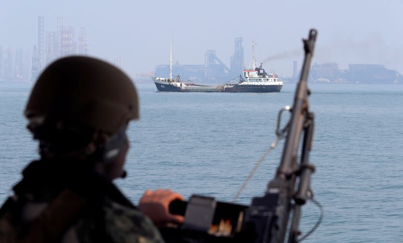 FILE PHOTO: A U.S. Navy soldier onboard Mark VI Patrol Boat stands guard during an exercise of U.S./UK Mine Countermeasures (MCMEX) taking place in Arabian Sea