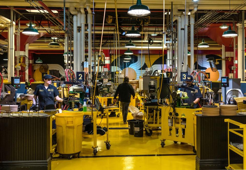 Press operators work at their stations at Third Man Pressing in the Midtown area of Detroit on March 29, 2022.