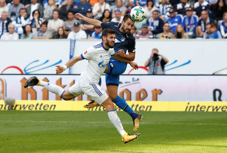 Soccer Football - Bundesliga - TSG 1899 Hoffenheim vs Schalke 04 - Rhein-Neckar-Arena, Hoffenheim, Germany - September 23, 2017 Hoffenheim’s Lukas Rupp heads at goal REUTERS/Michaela Rehle